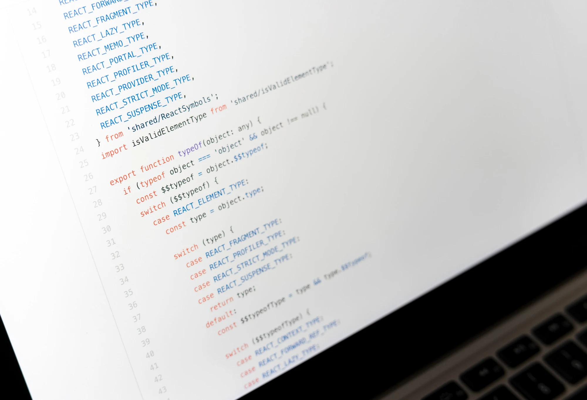 Close-up of source code on a laptop representing a configurable CRM workspace