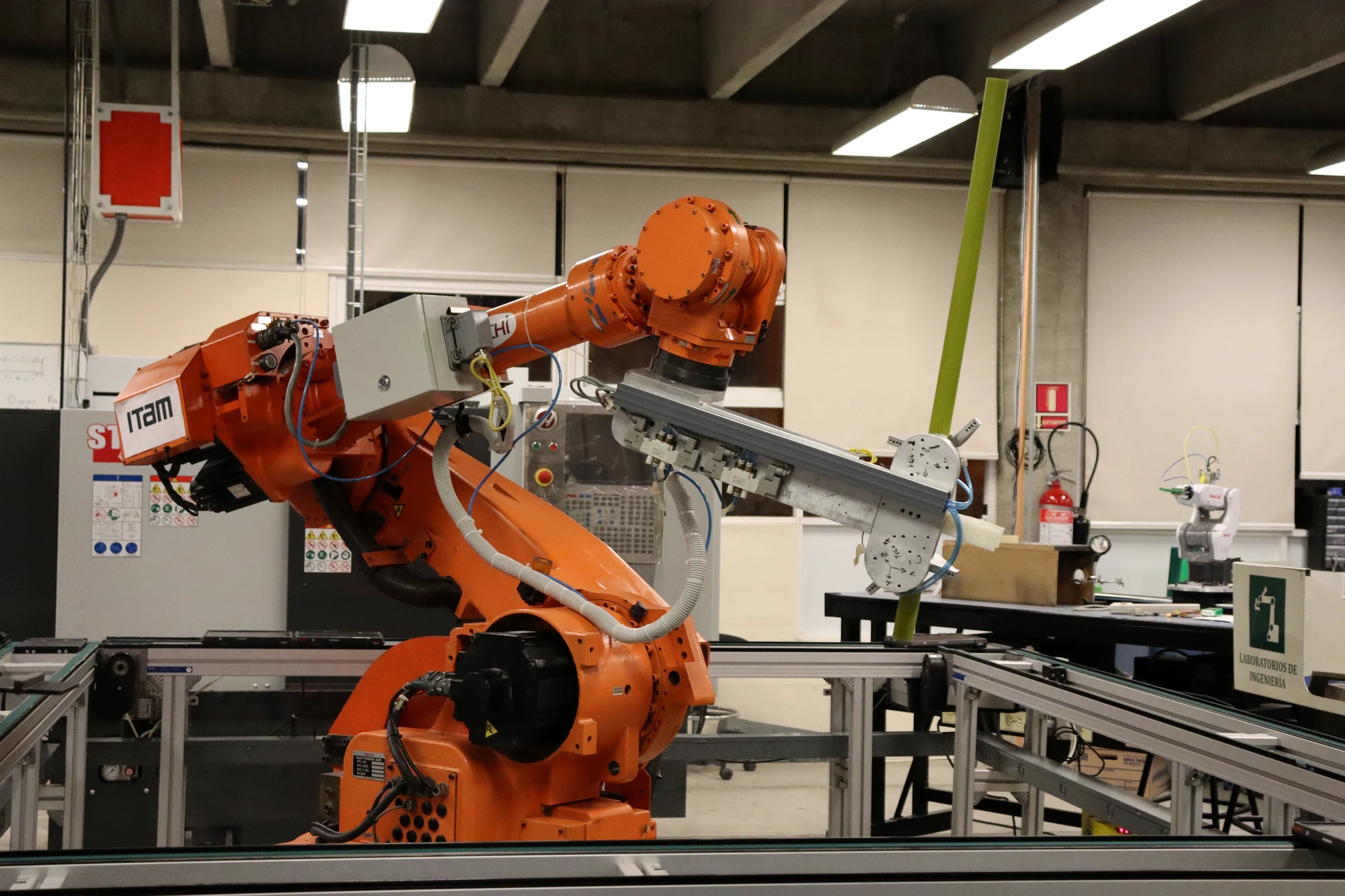 Industrial robotic arm in a laboratory automation environment