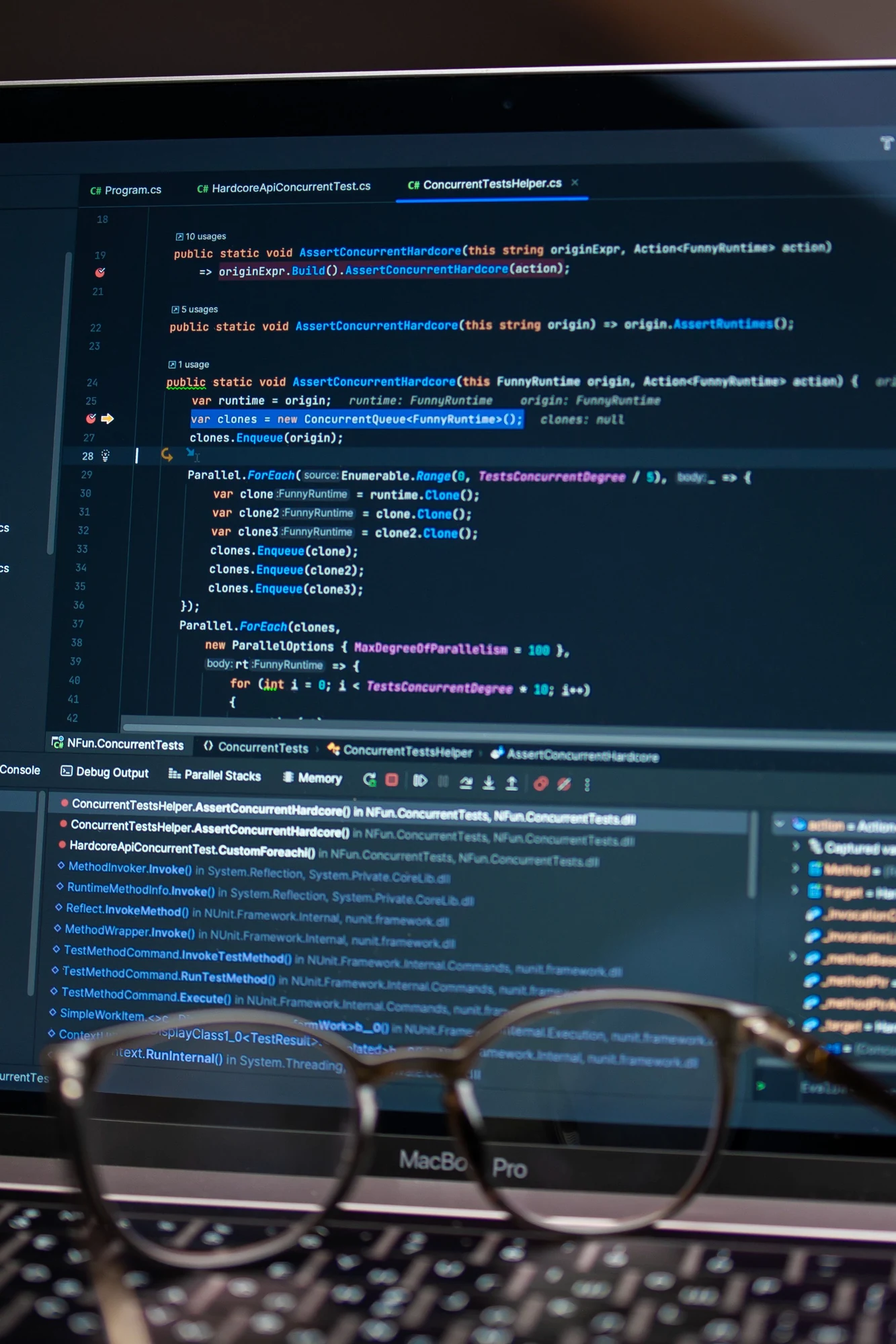 Laptop displaying debugging and software development tools for custom CRM ERP engineering