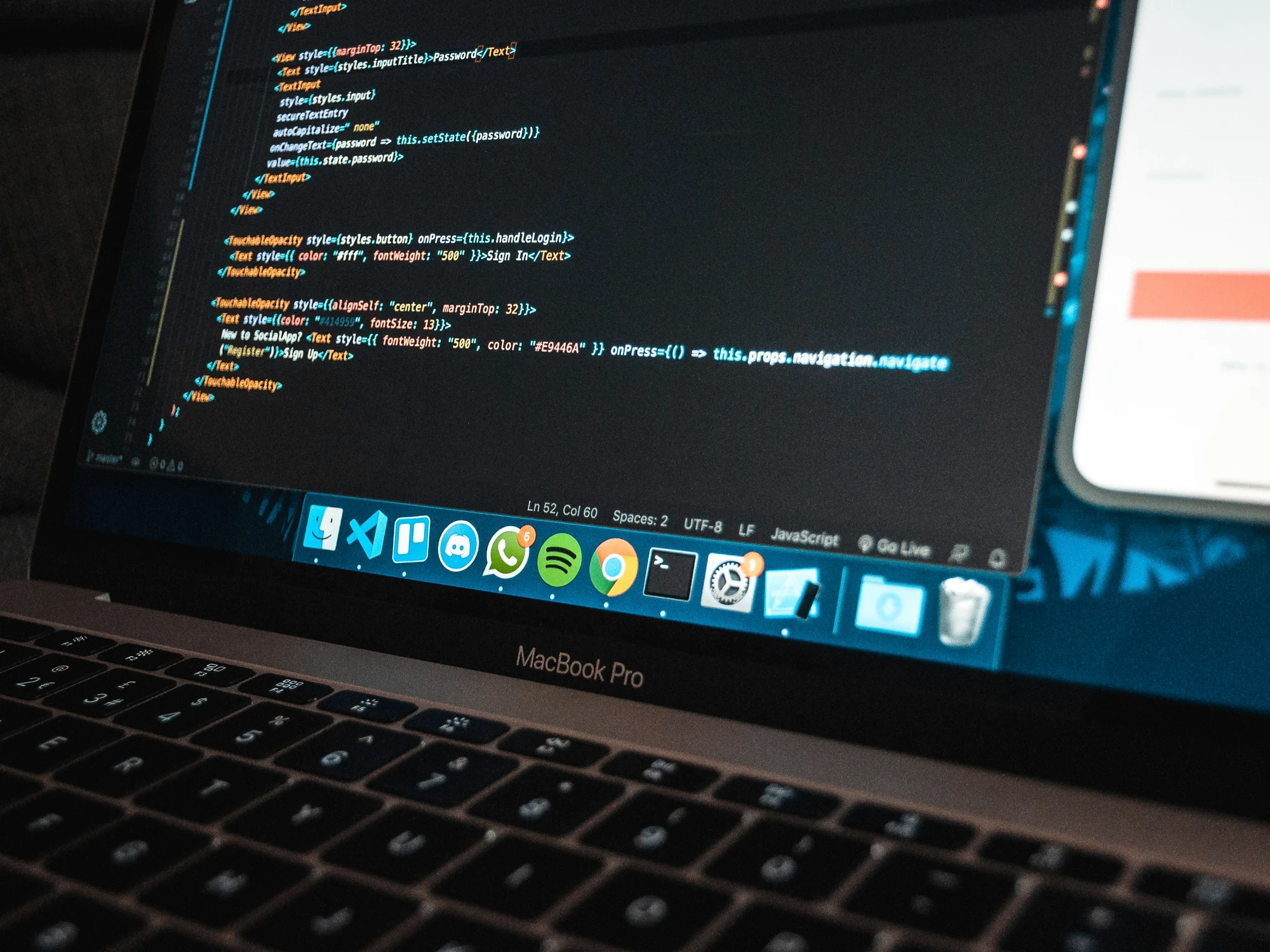Laptop with development environment representing custom CRM and ERP engineering
